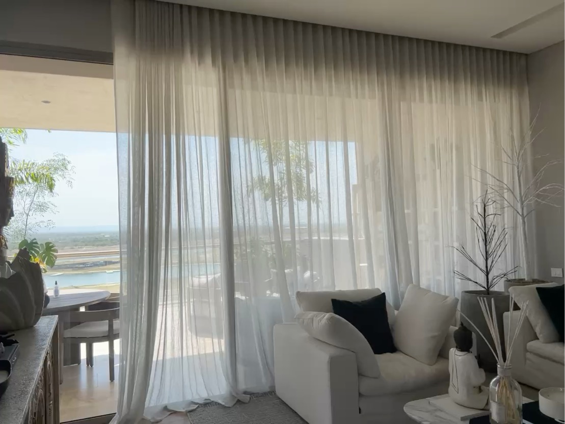 Custom drapery framing an ocean view